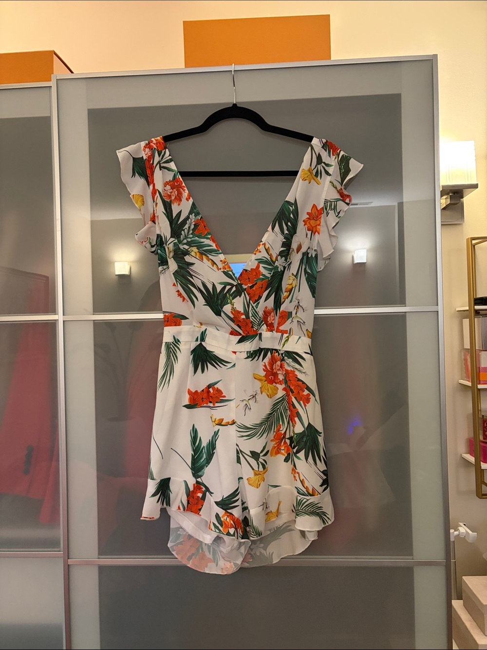 PrettyLittleThing White Floral V‑Neck Romper with Orange & Green Print
